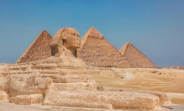 Ancient Egyptian stone carvings and hieroglyphs on temple walls in Luxor