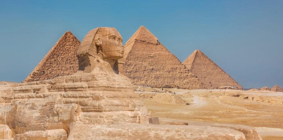 Ancient Egyptian stone carvings and hieroglyphs on temple walls in Luxor