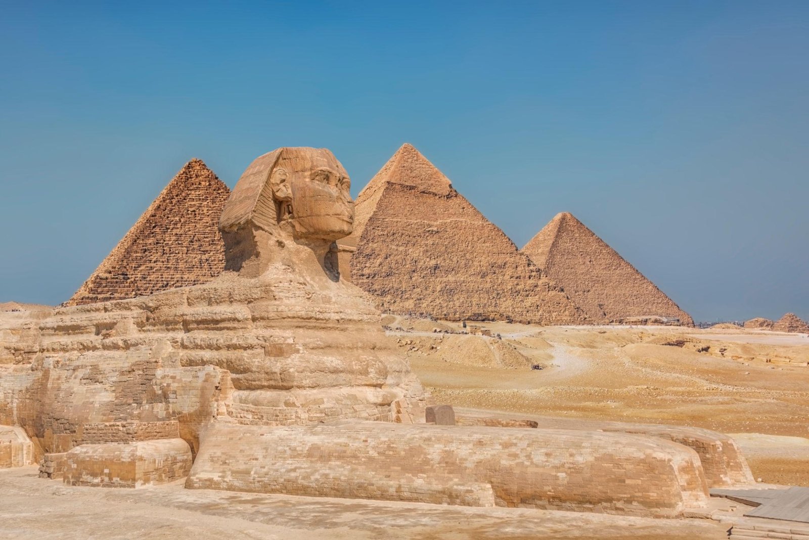 Ancient Egyptian stone carvings and hieroglyphs on temple walls in Luxor